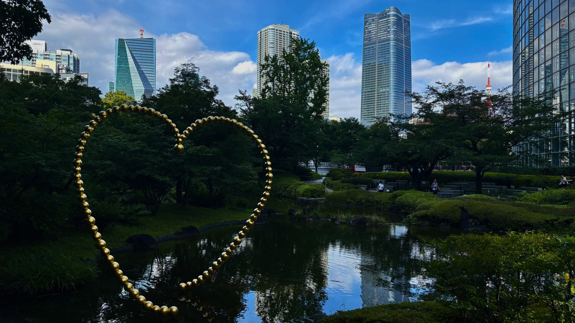 Mohri Garden pond and planting surrounded by the high-rise buildings of Roppongi Hills